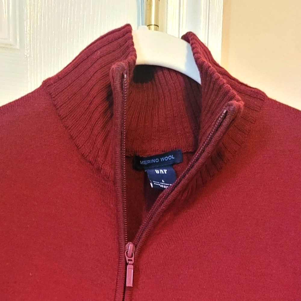 Zip up GAP sweater in fair condition, maroon/or burgundy size large